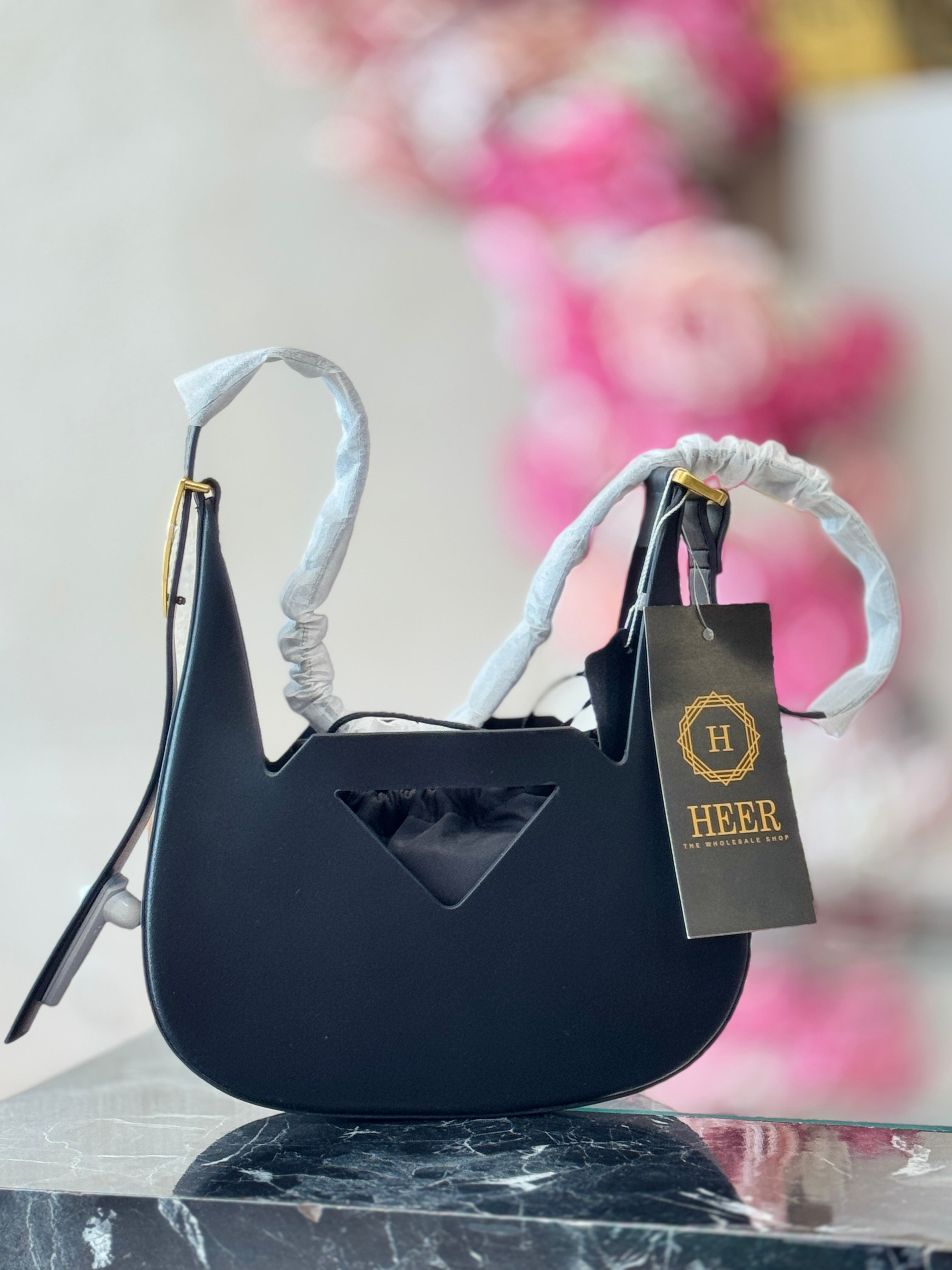 Q562711 Architectural Cut-Out Bucket Handbag