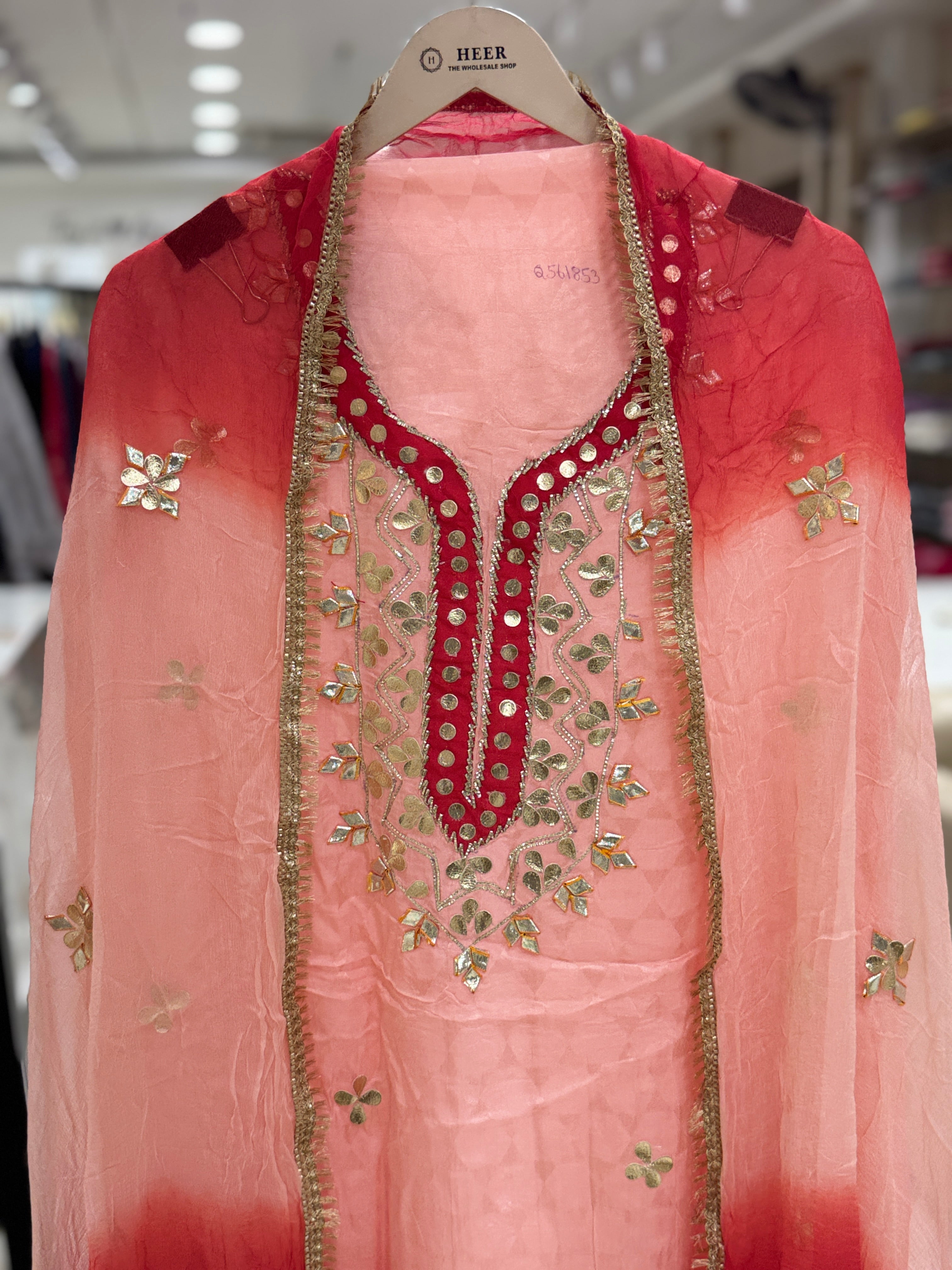 Q561853 Hand-crafted Gota Patti work on the neckline and borders