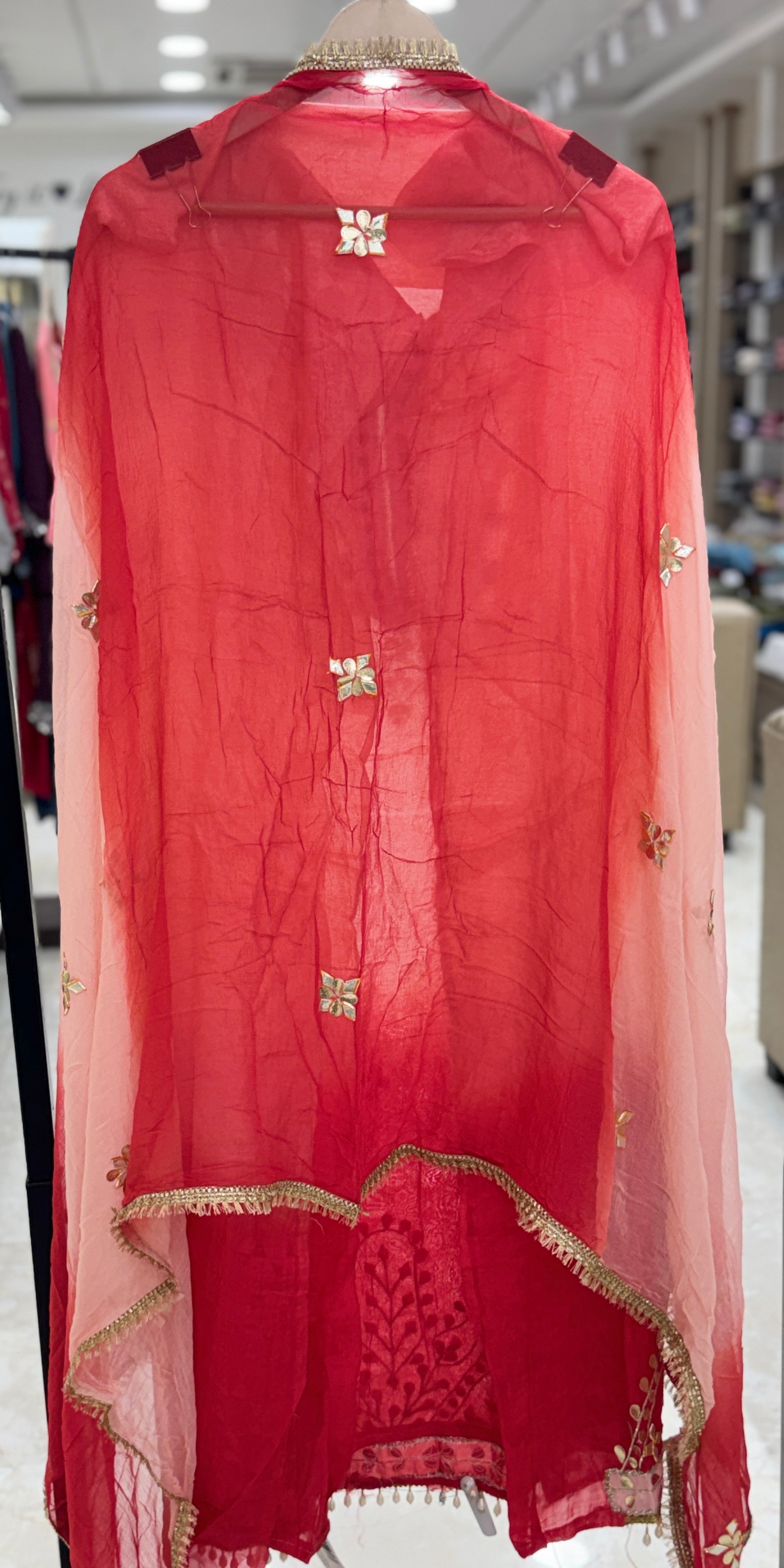 Q561853 Hand-crafted Gota Patti work on the neckline and borders
