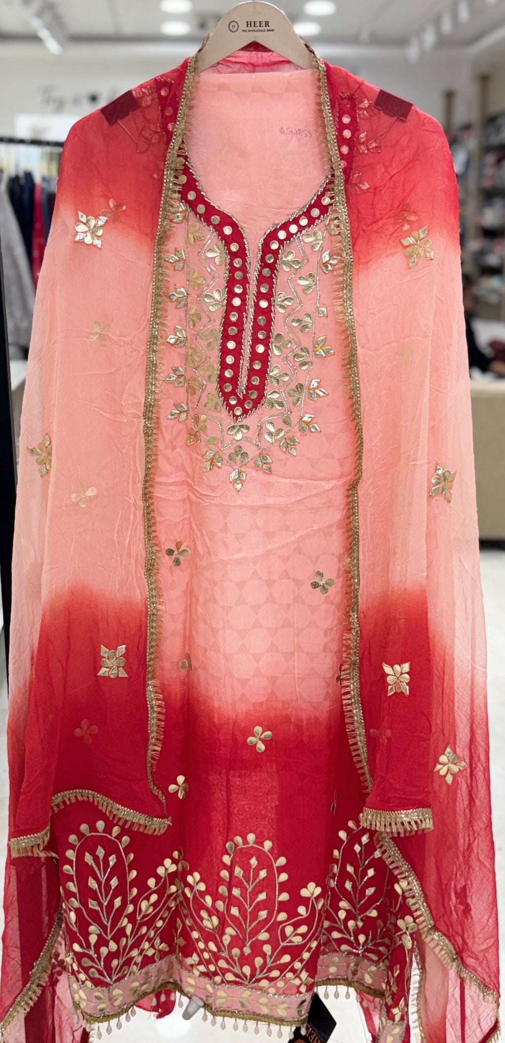 Q561853 Hand-crafted Gota Patti work on the neckline and borders