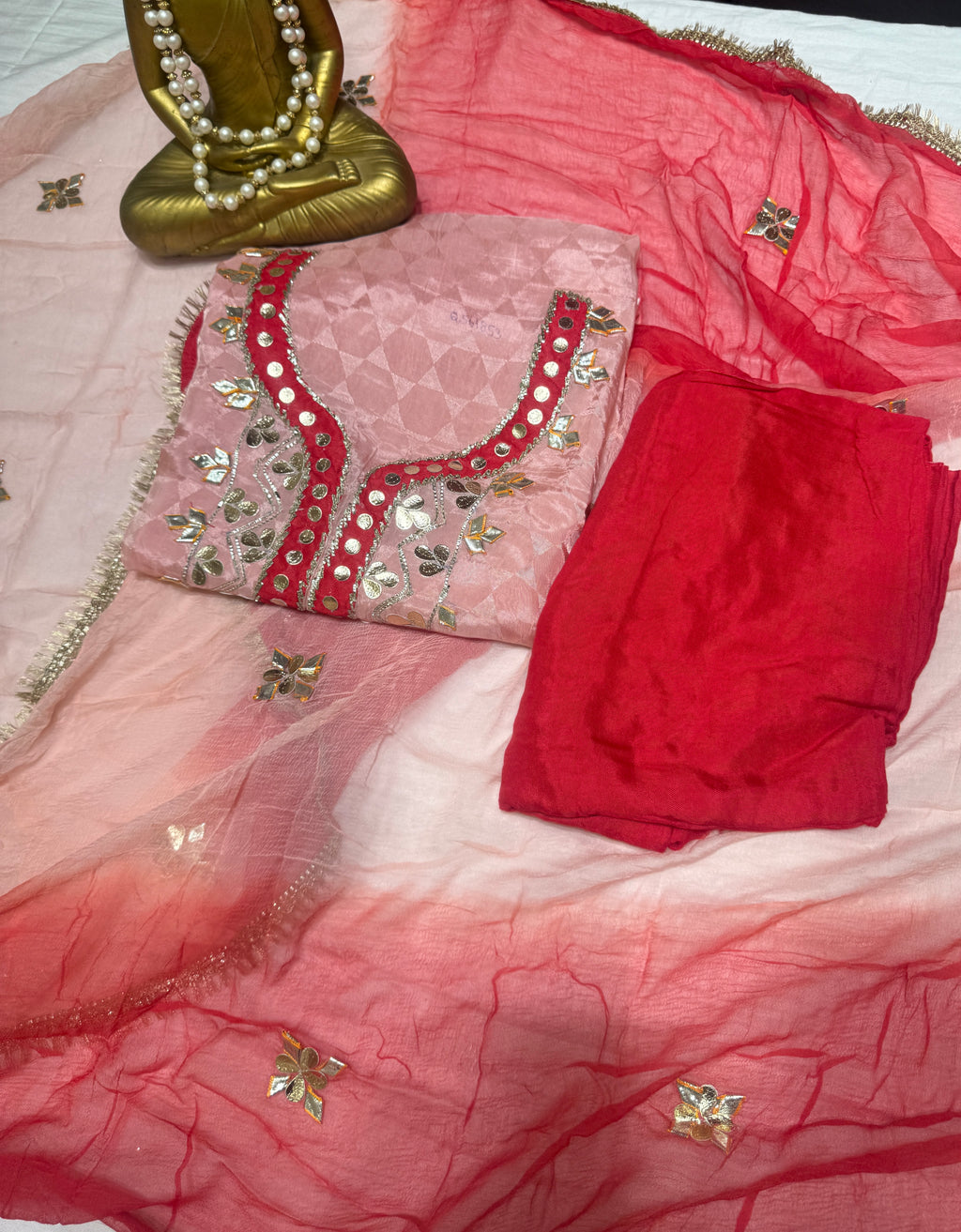 Q561853 Hand-crafted Gota Patti work on the neckline and borders