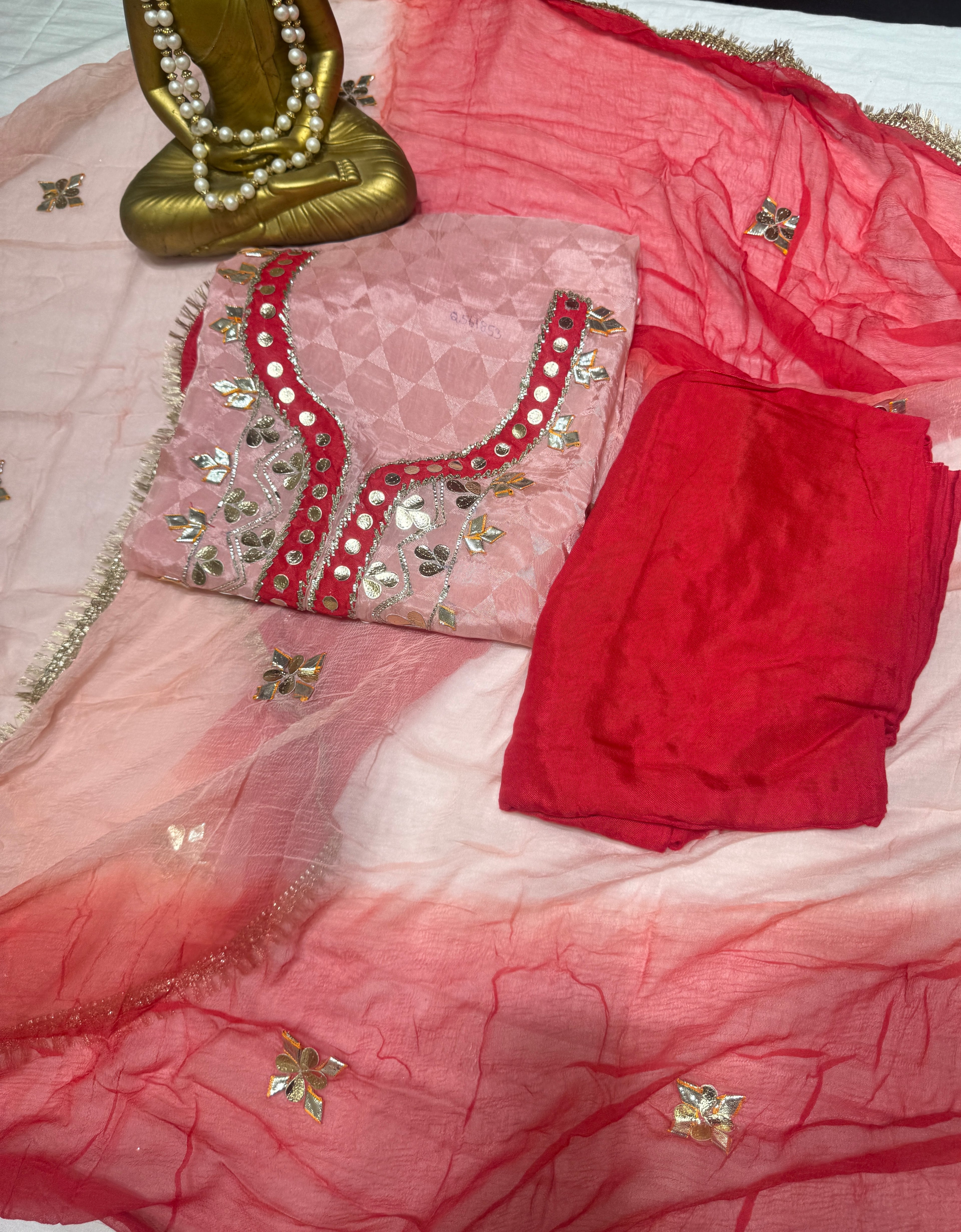 Q561853 Hand-crafted Gota Patti work on the neckline and borders