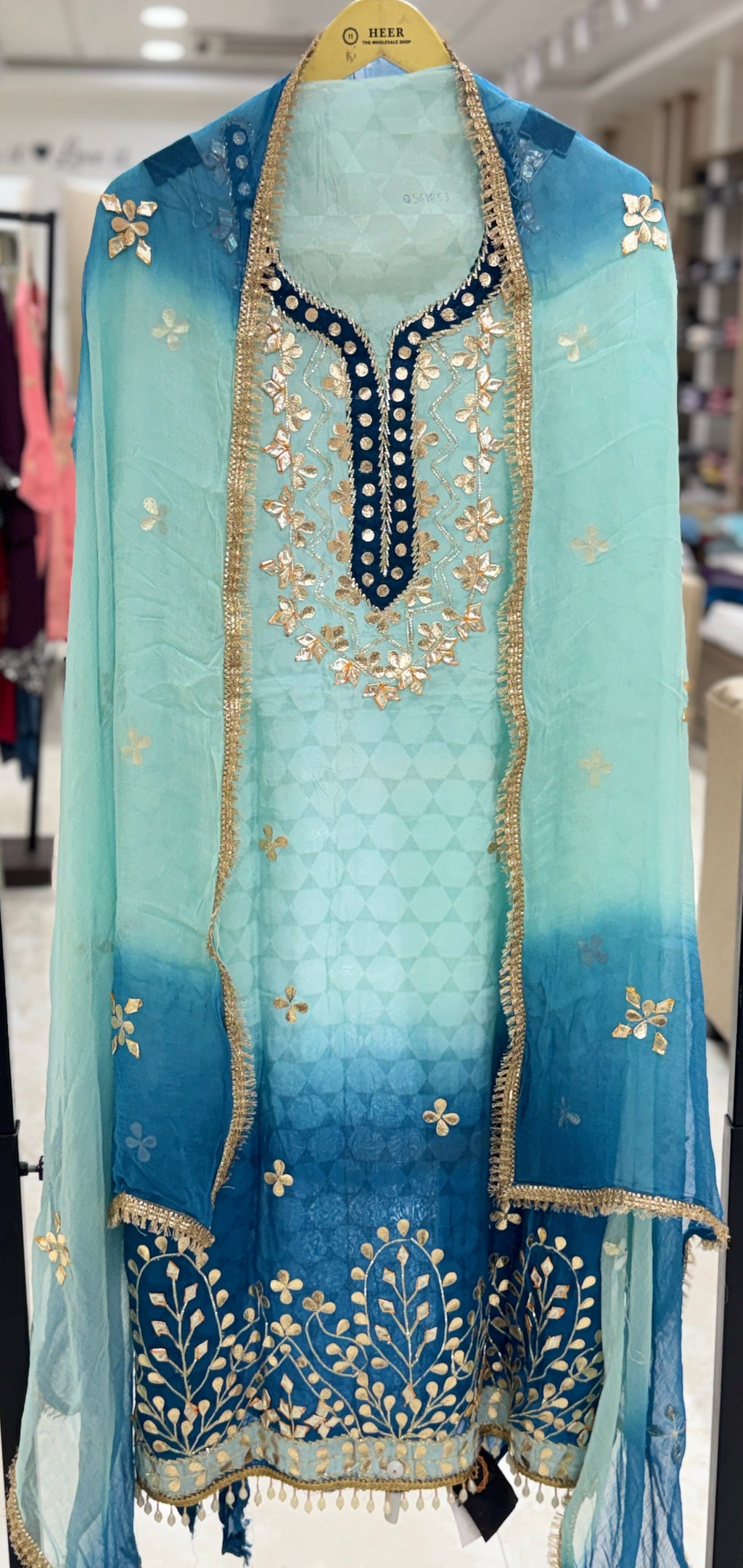 Q561853 Hand-crafted Gota Patti work on the neckline and borders