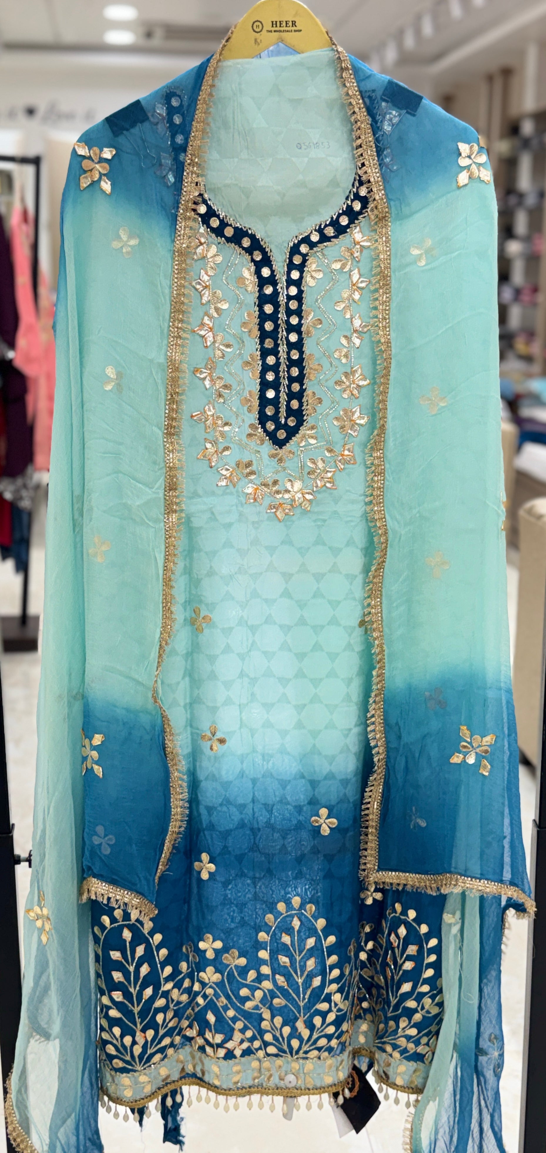 Q561853 Hand-crafted Gota Patti work on the neckline and borders