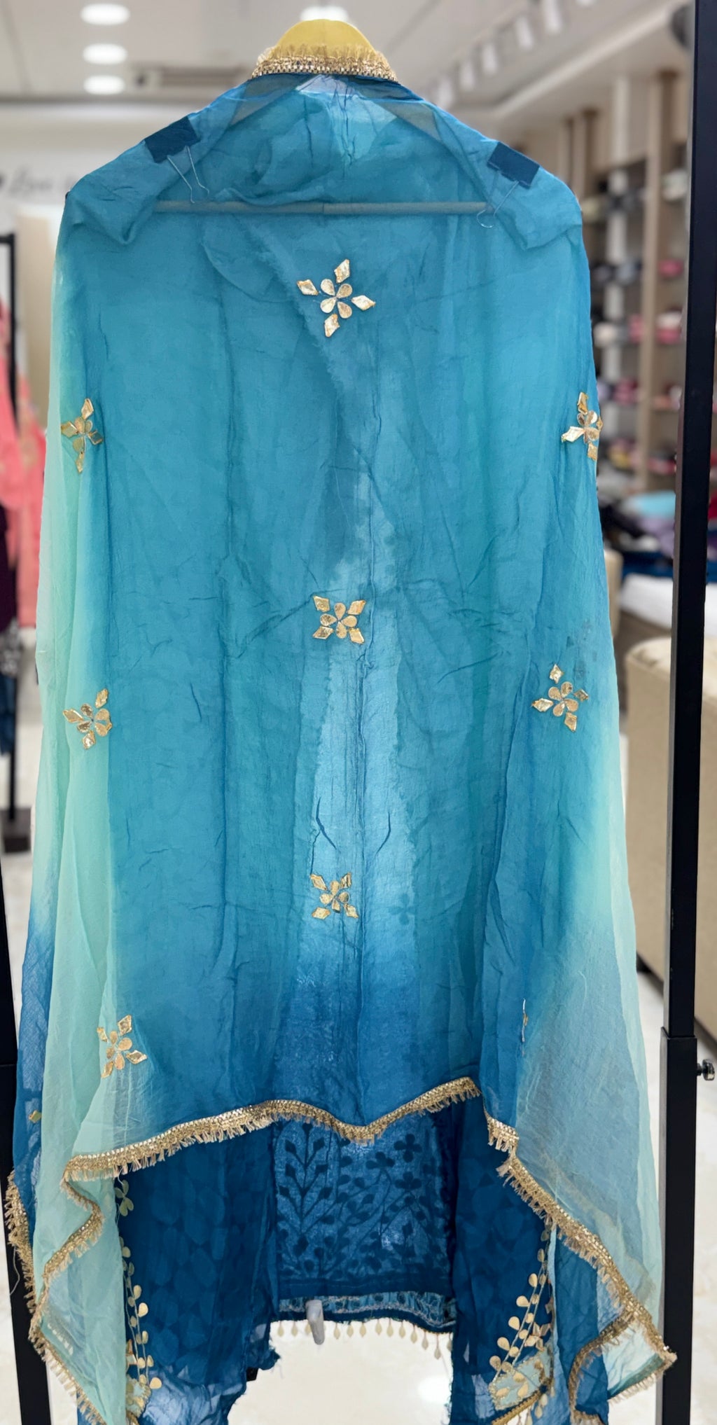 Q561853 Hand-crafted Gota Patti work on the neckline and borders