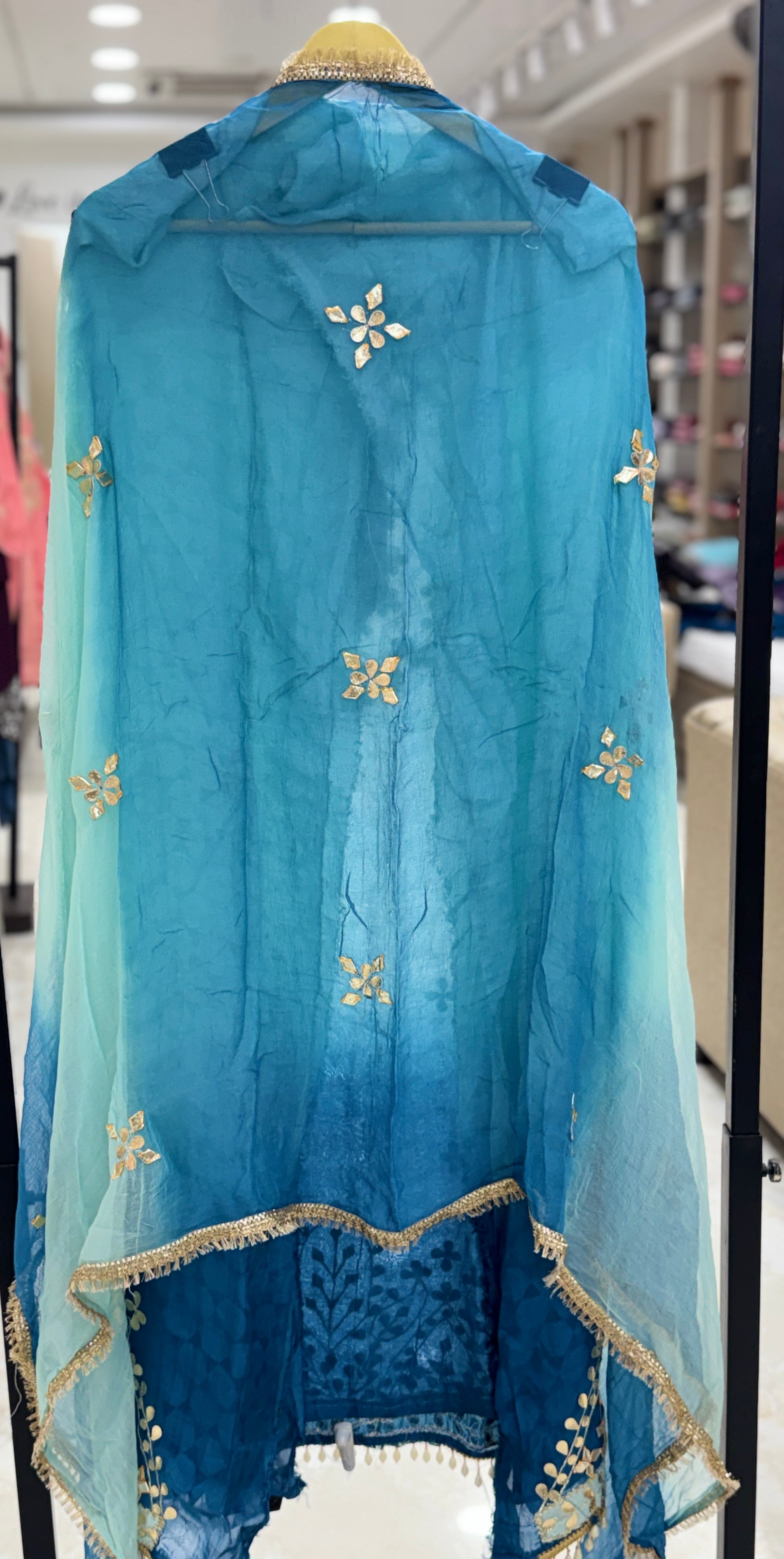 Q561853 Hand-crafted Gota Patti work on the neckline and borders