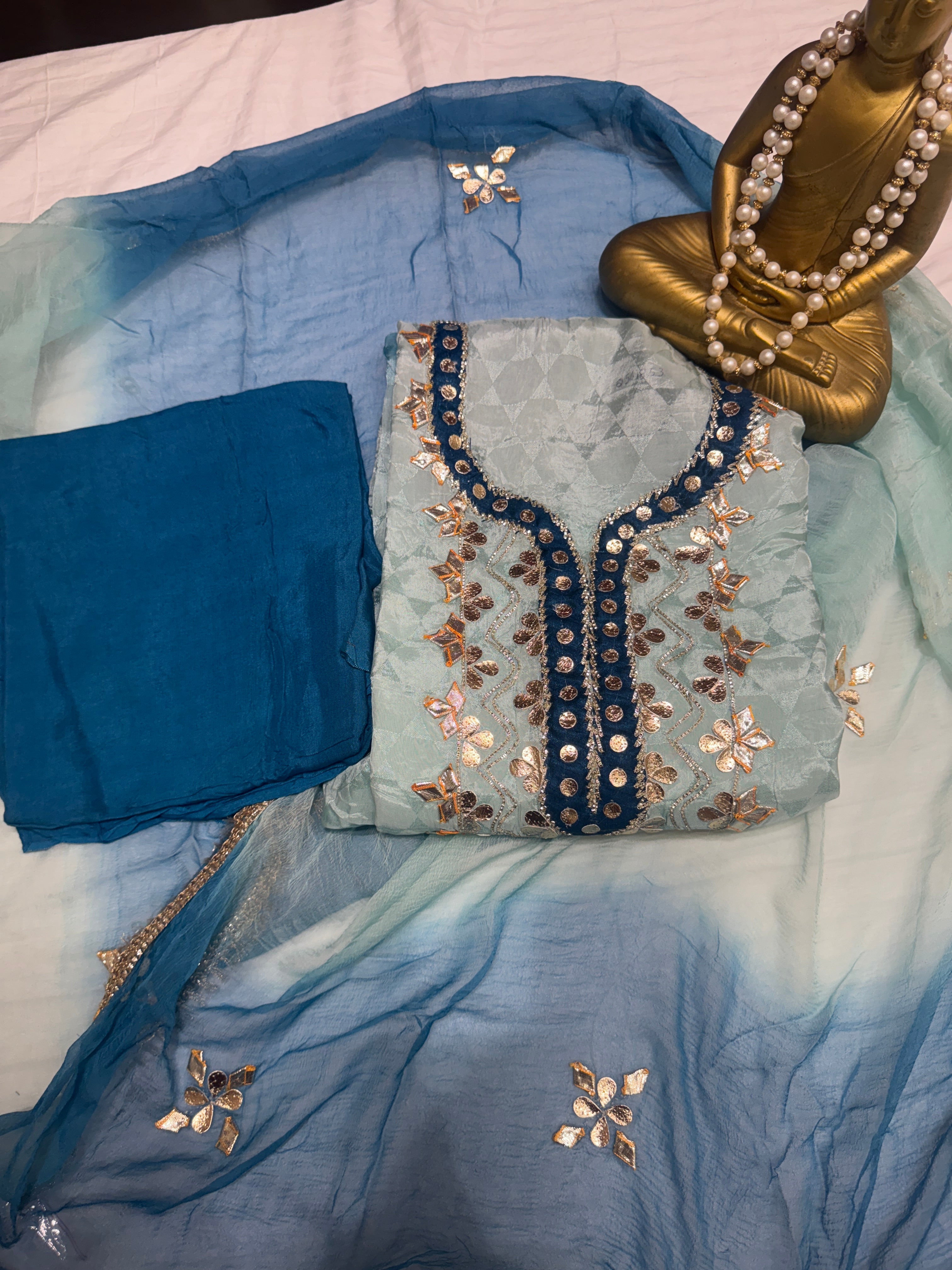 Q561853 Hand-crafted Gota Patti work on the neckline and borders