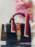 Q562710 black handbag with bold red stripe detailing