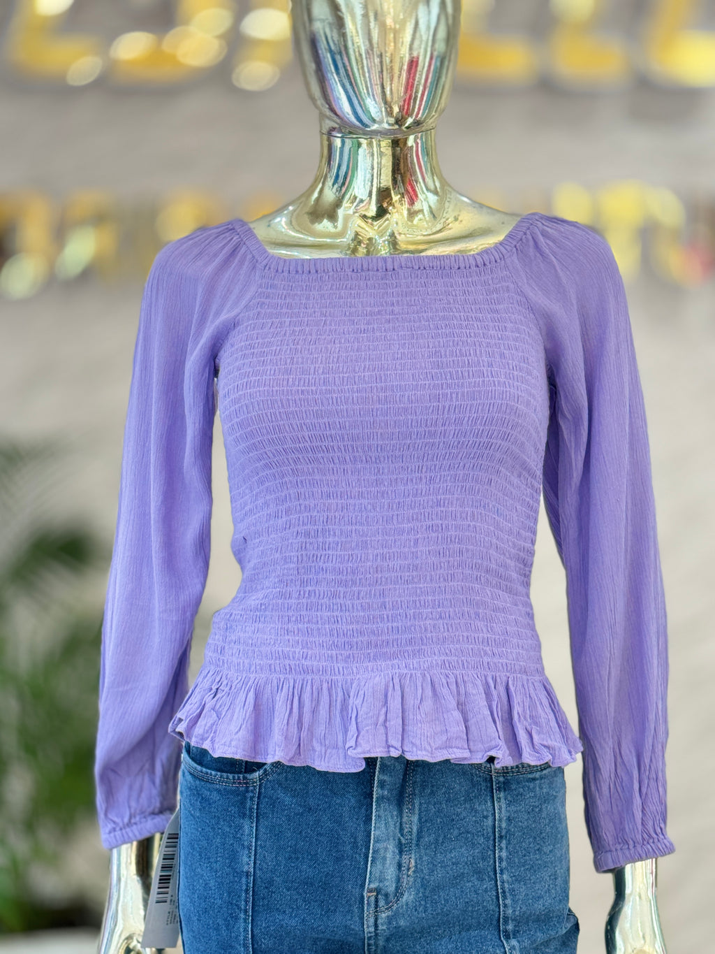 Q562754 Elegant lavender smocked peplum top with full sleeves and a flattering square neckline.