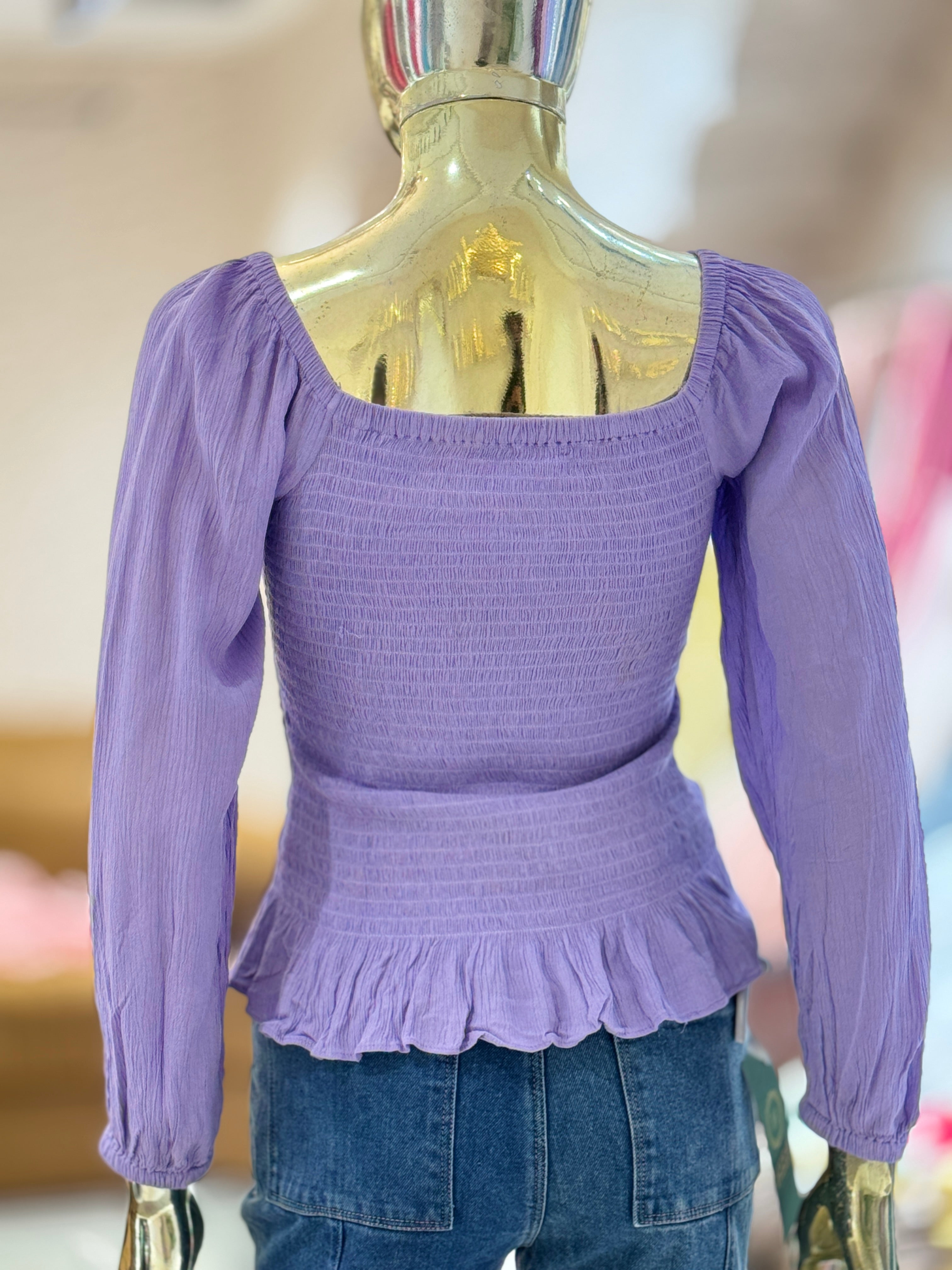 Q562754 Elegant lavender smocked peplum top with full sleeves and a flattering square neckline.