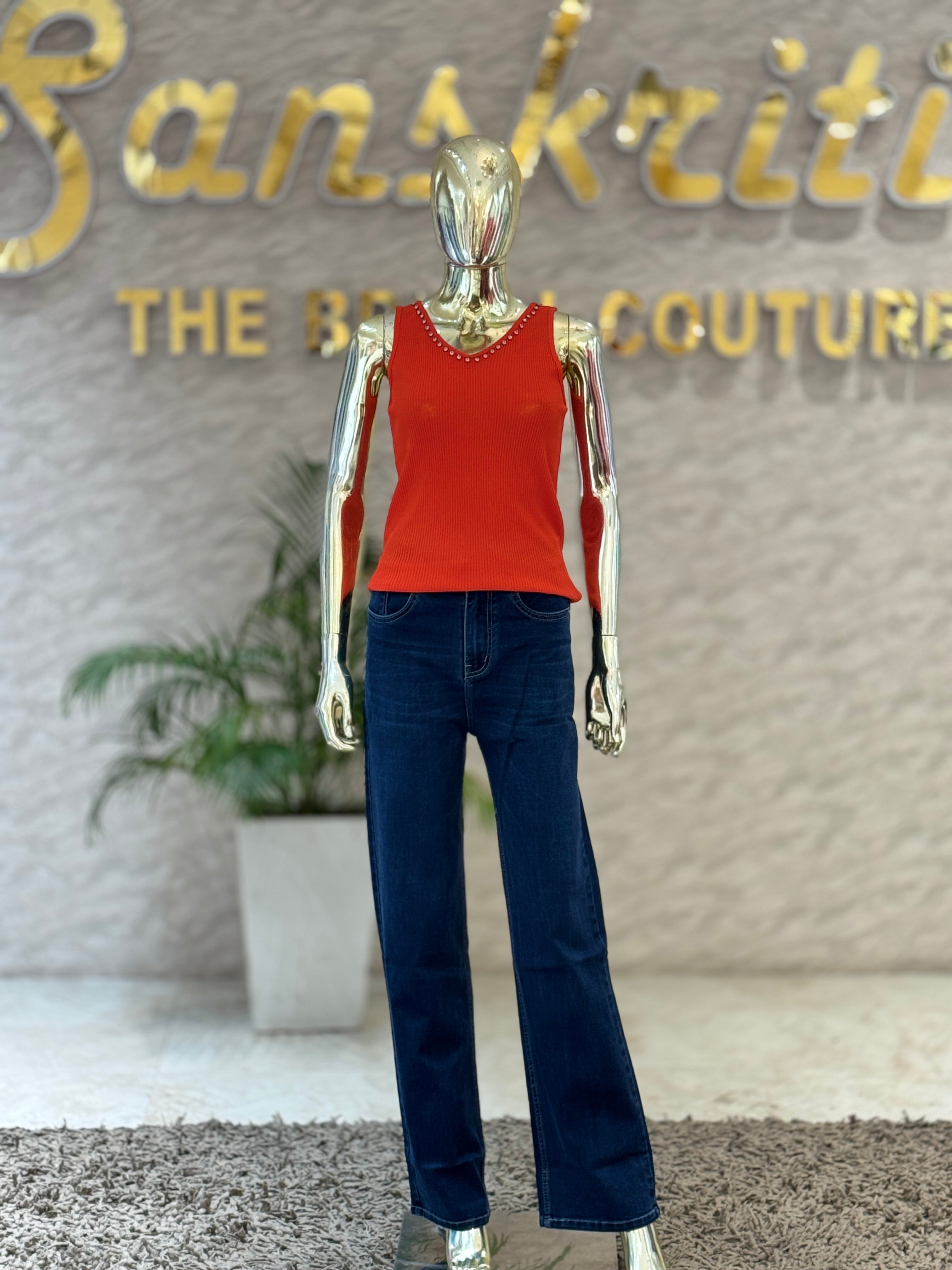 Q562325 Trendy dark orange sleeveless top with pearl neckline and stylish crisscross back design.