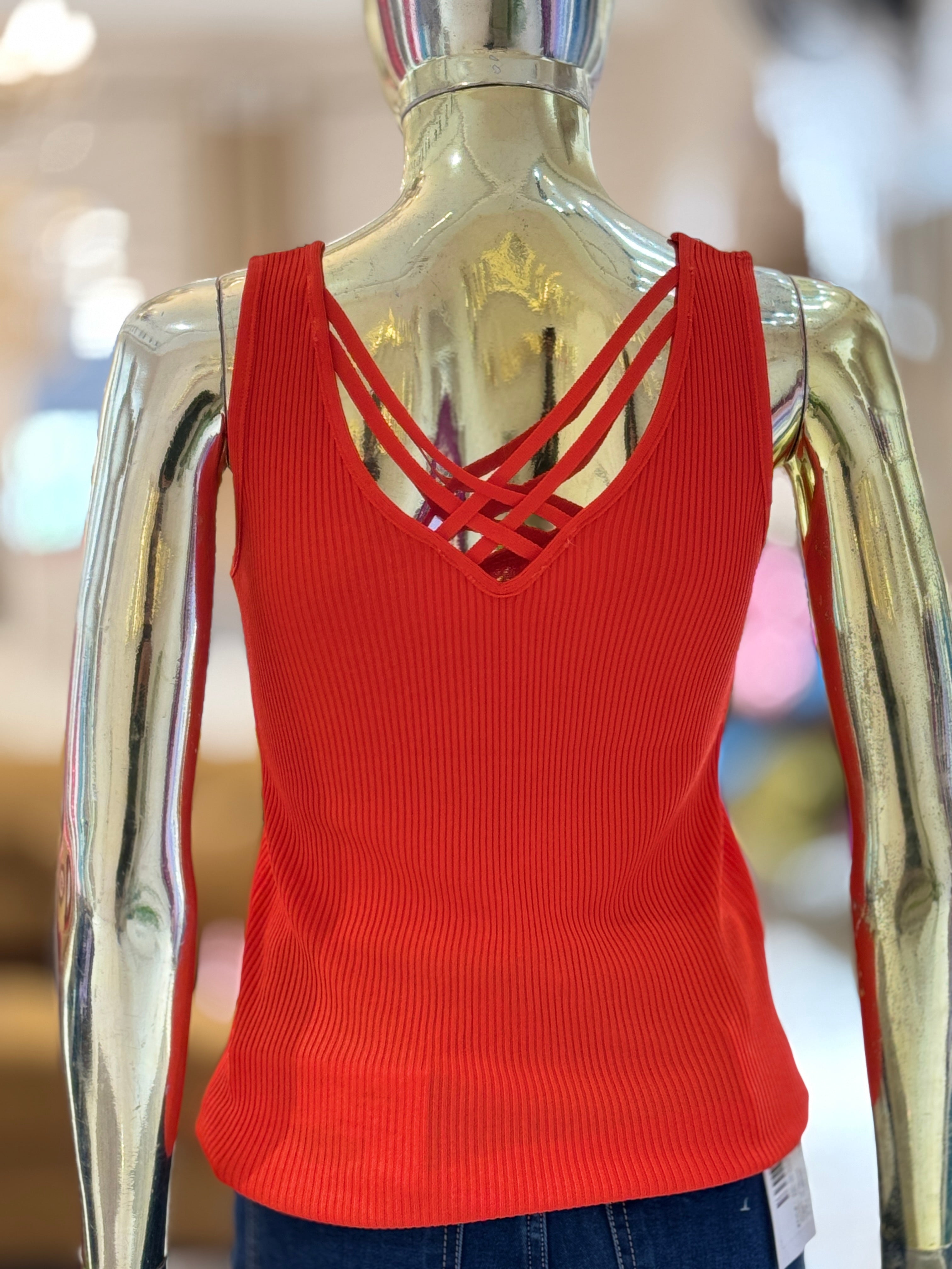 Q562325 Trendy dark orange sleeveless top with pearl neckline and stylish crisscross back design.