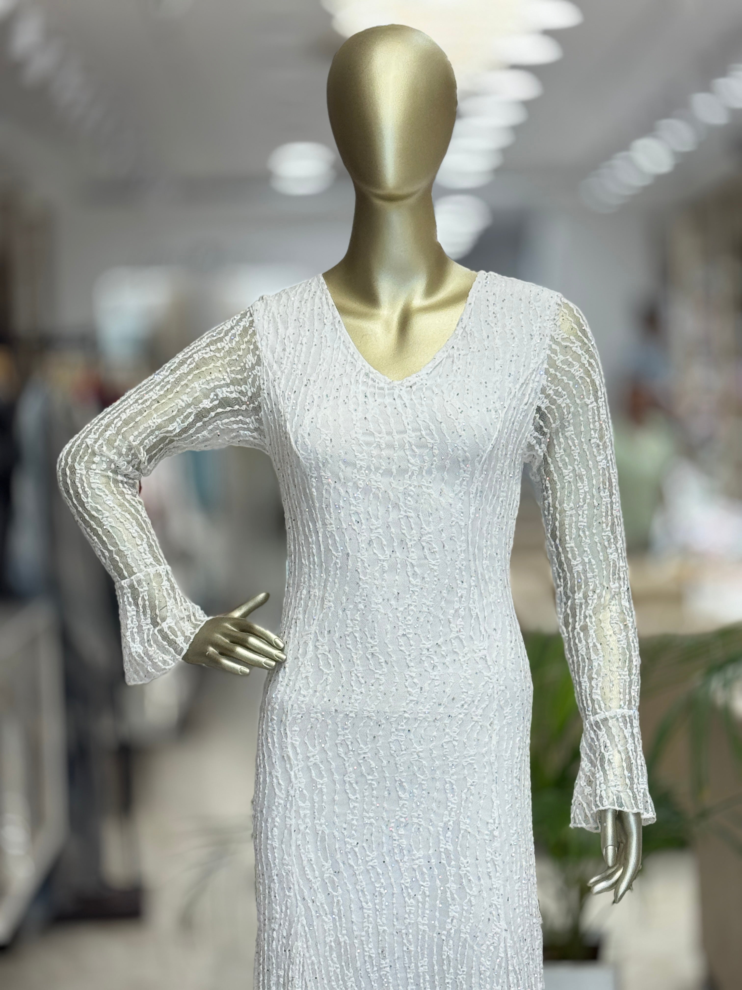 Q562312 Elegant white embellished gown with fringe detailing and statement sleeves.