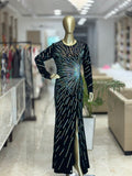 Q562152 Elegant black sequin gown with dazzling starburst detailing and a sleek front slit