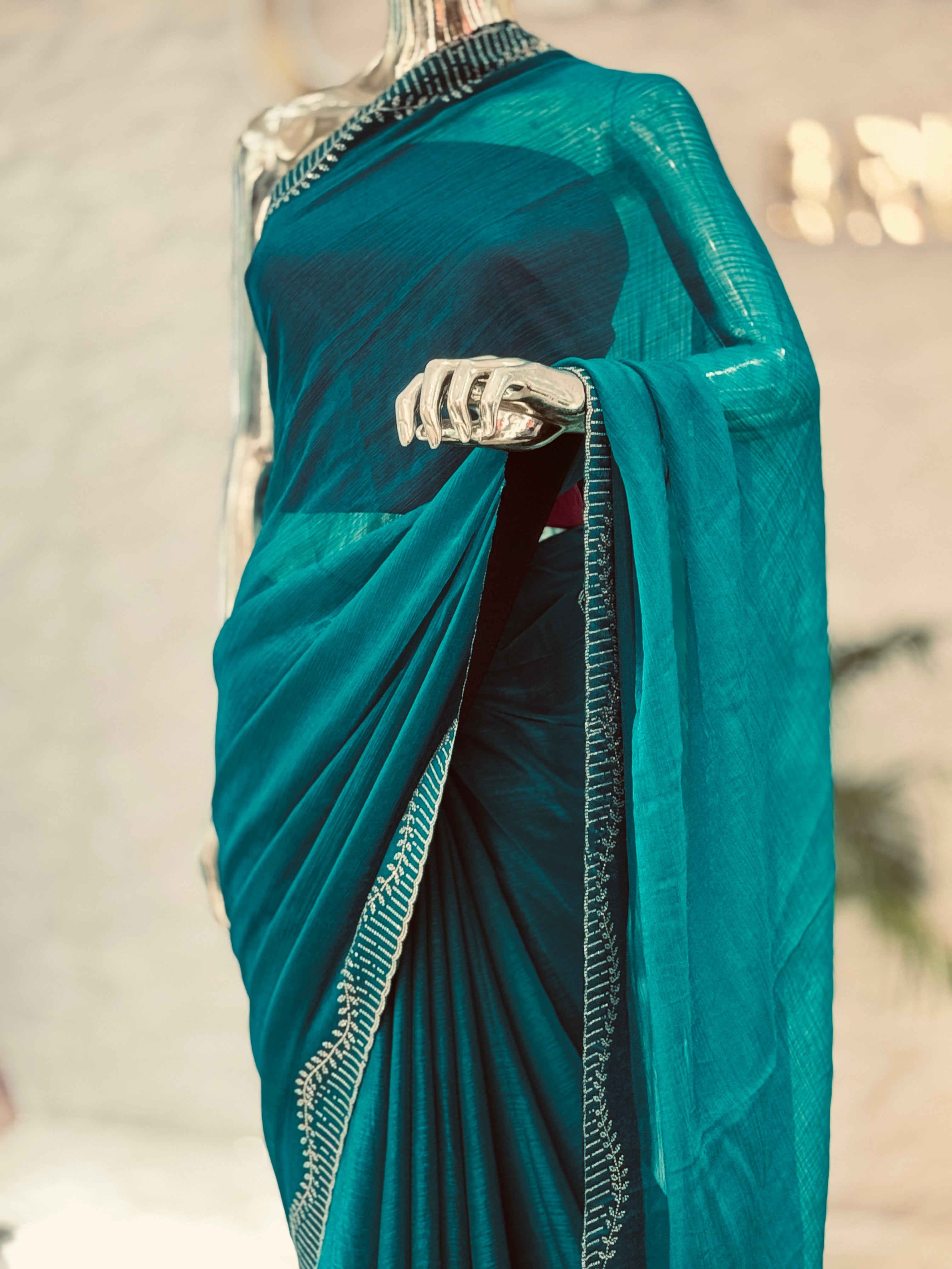 Majestic Peacock Teal Crinkle Silk Saree with Hand-Studded Border q562437