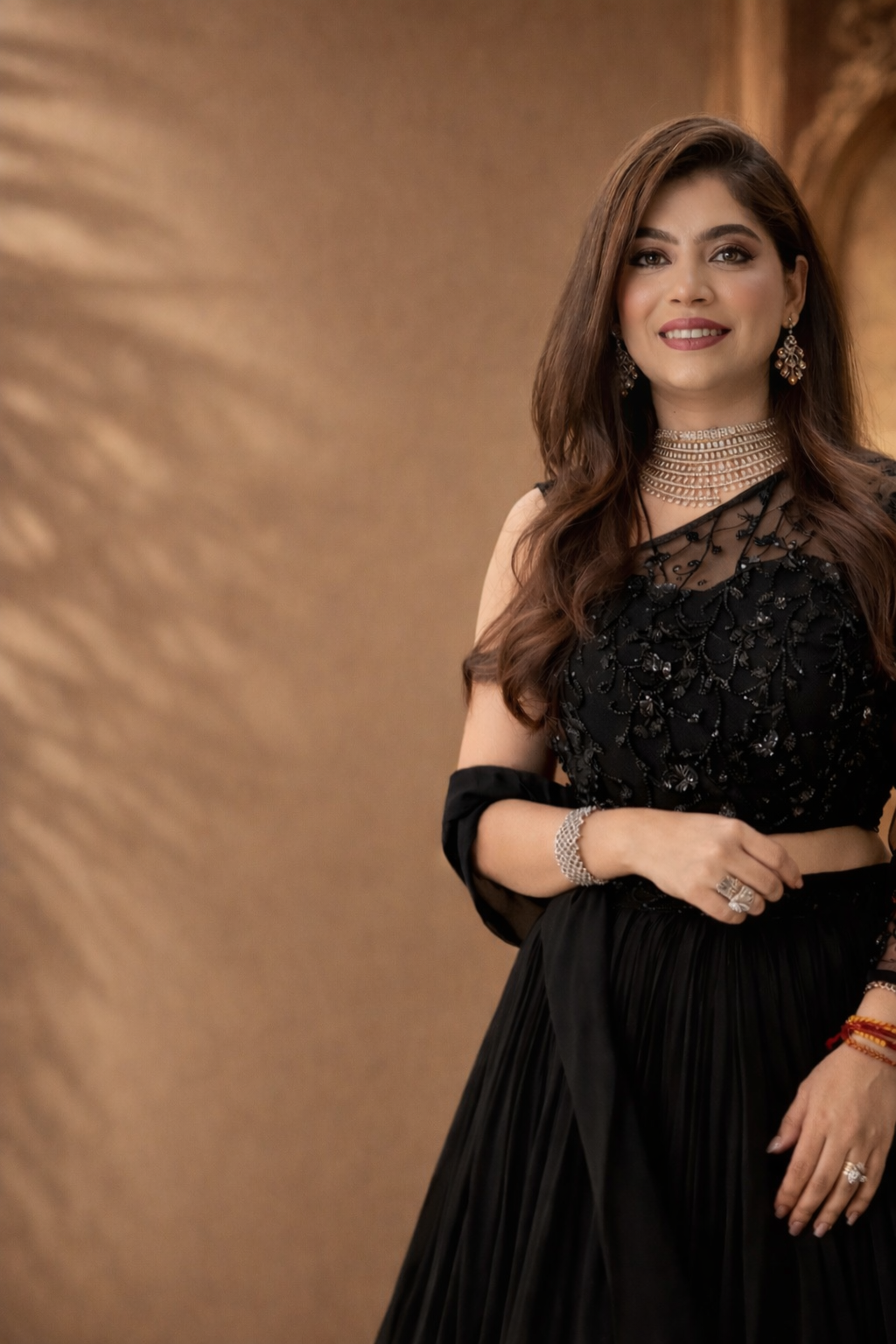 Woman in a black dress with a textured brown background